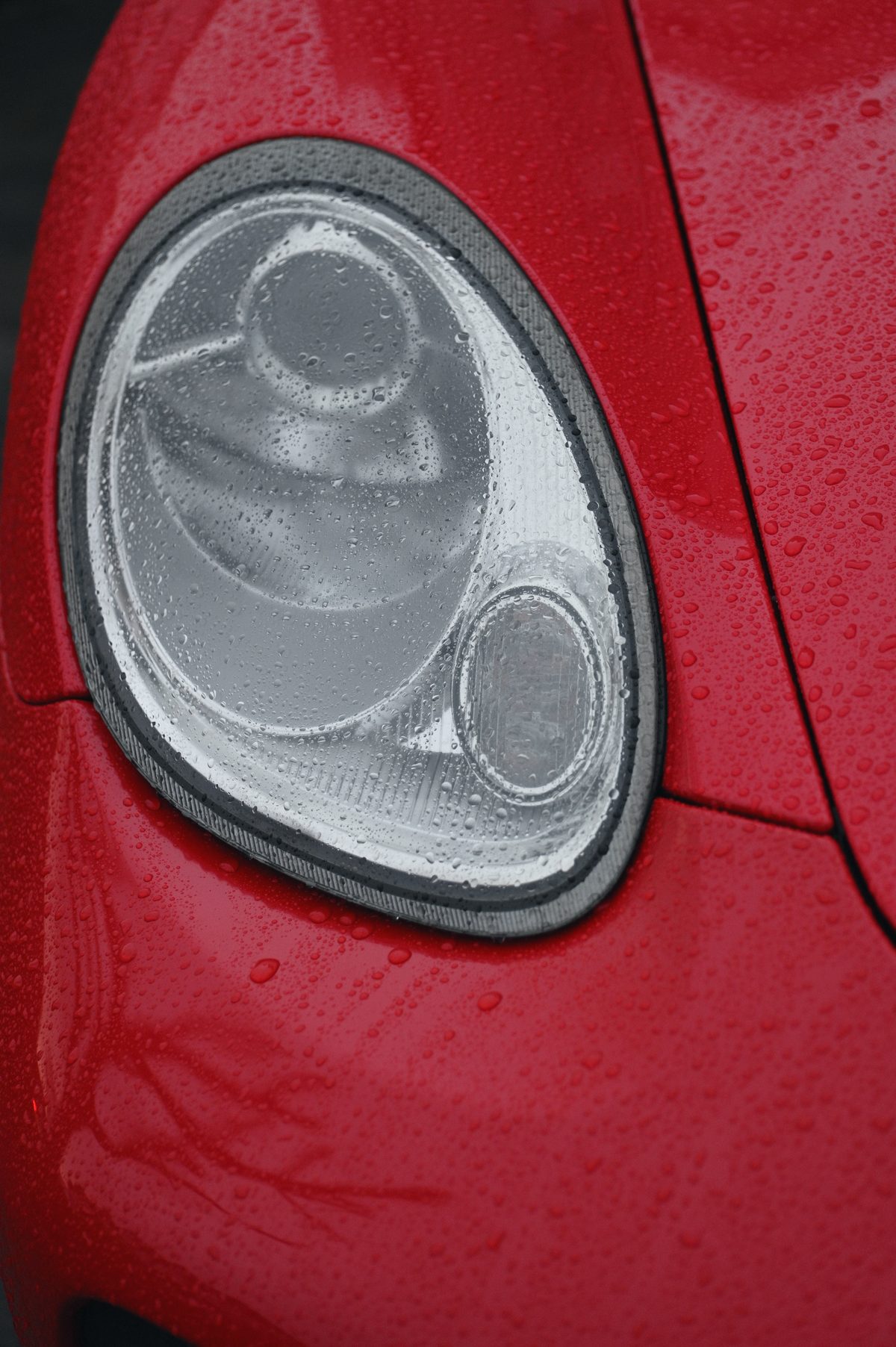 A Cayman headlamp in the rain, upright.