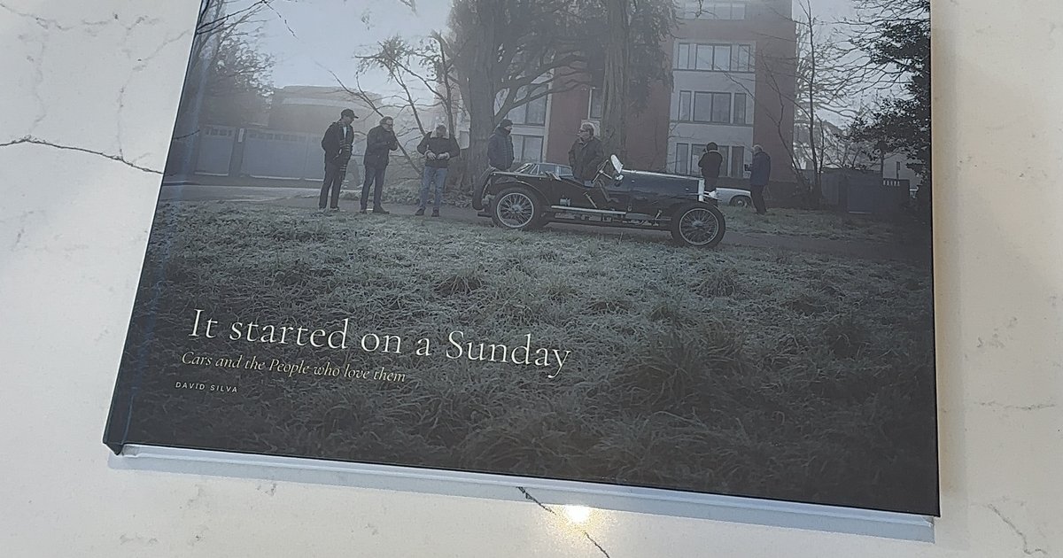 The printed hardcover of It Started on a Sunday on a marble counter.